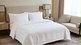 酒店布草洗涤褶皱问题的成因与应对策略